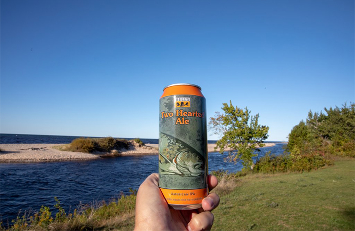 A can of Two Hearted at the mouth of the Two Hearted River, its namesake.