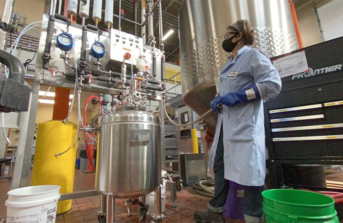 A Bell's Microbiologist harvests yeast at the brewery in Comstock.