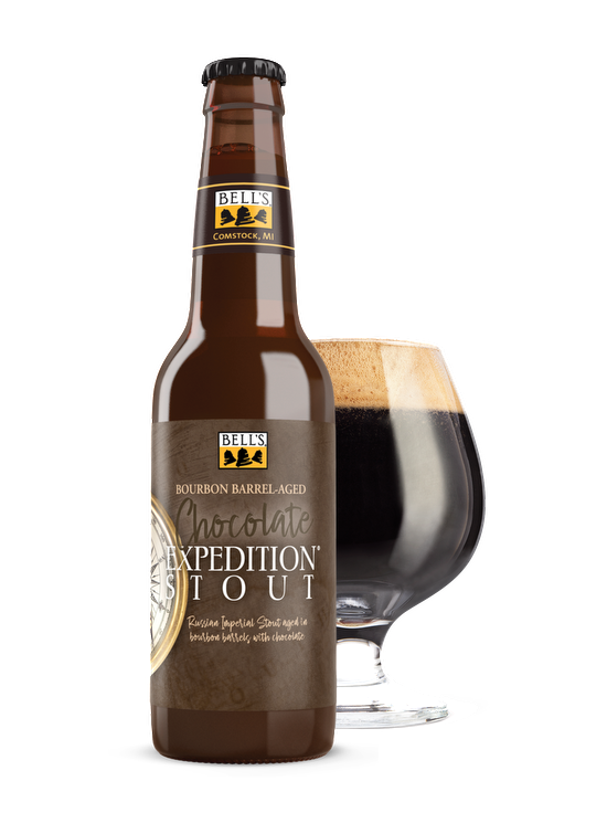 A Bottle of Chocolate Expedition Stout sitting in front of a full snifter glass