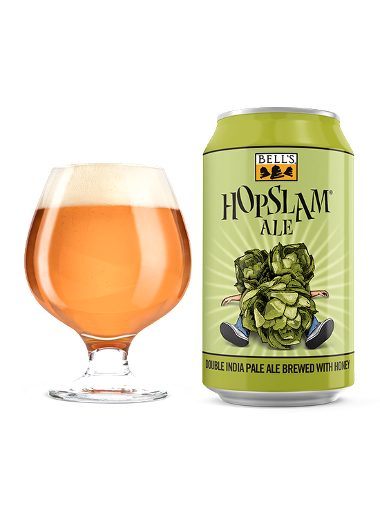 A full snifter glass sitting next to Hopslam Ale