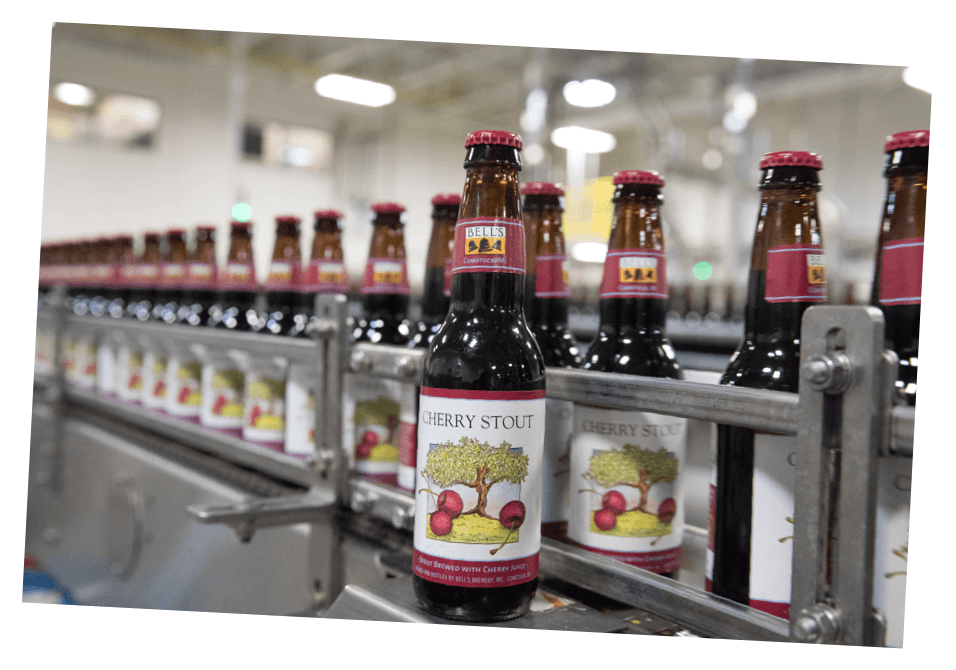 Bottles of Cherry Stout on a conveyer belt