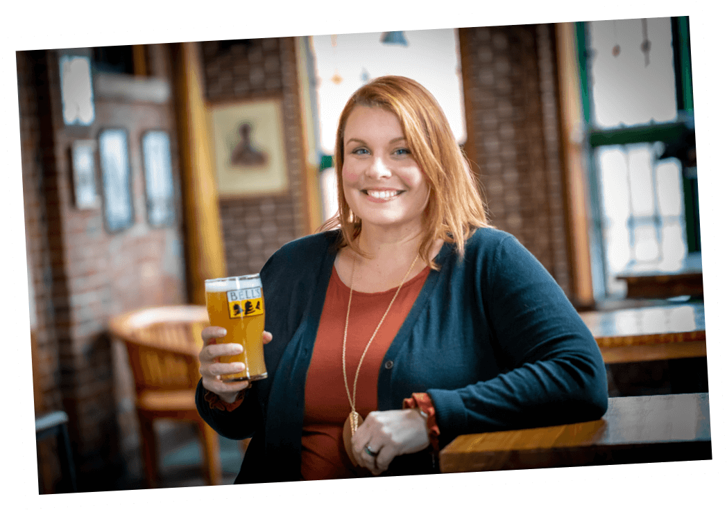 Photo of Carrie Yunker holding a pint of beer