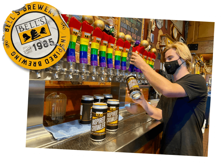 image of a bartender filling glasses with Bell's beer