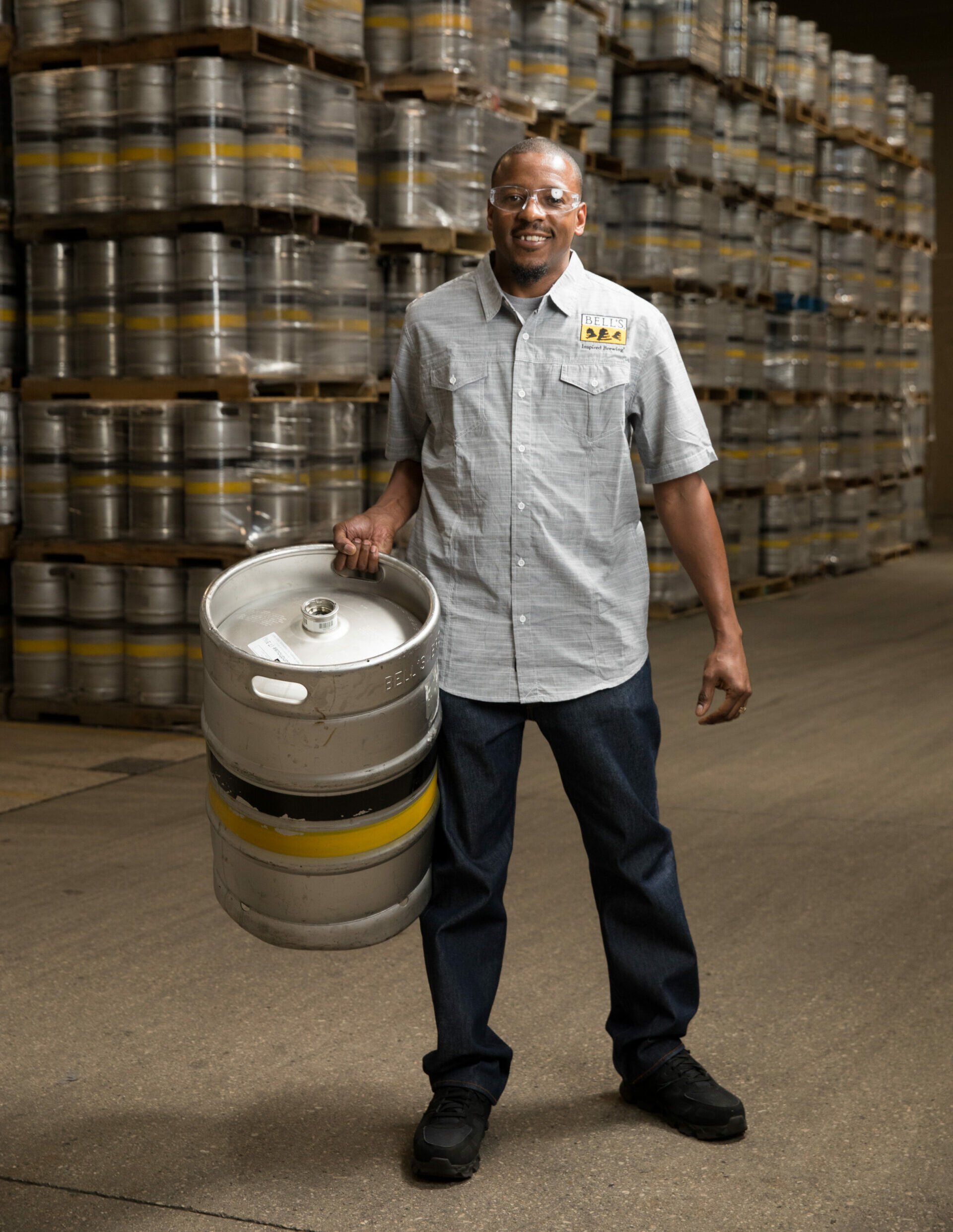 Man holding barrel smiling