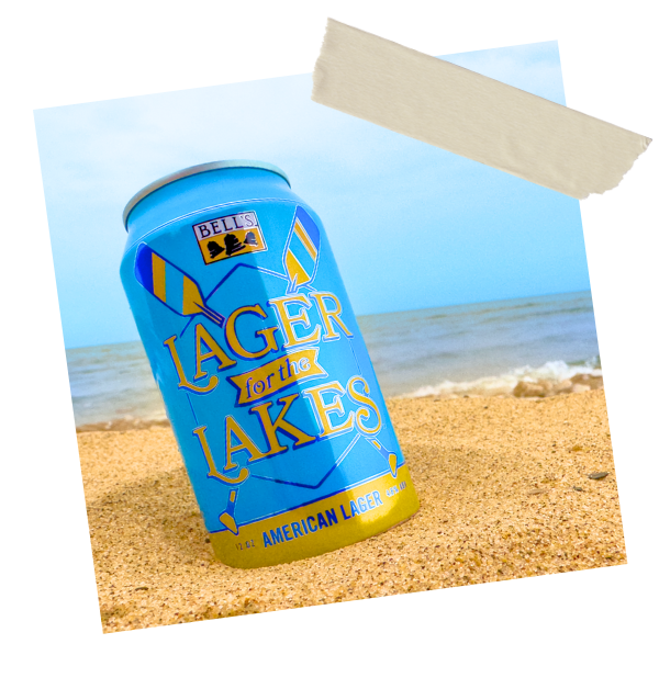 Lager for the Lakes can in sand on beach