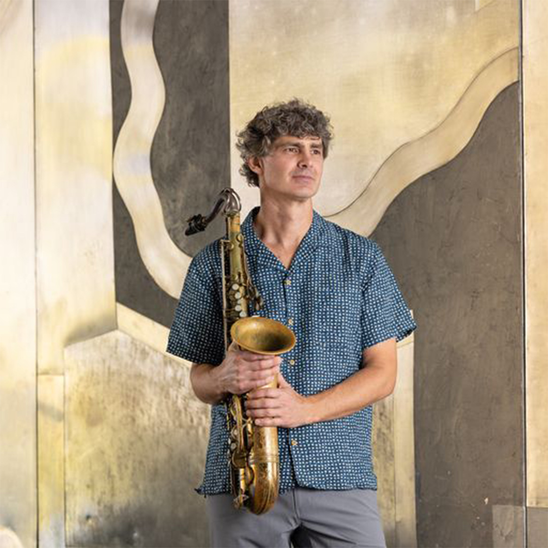 Andrew Rathbun posed with a saxophone