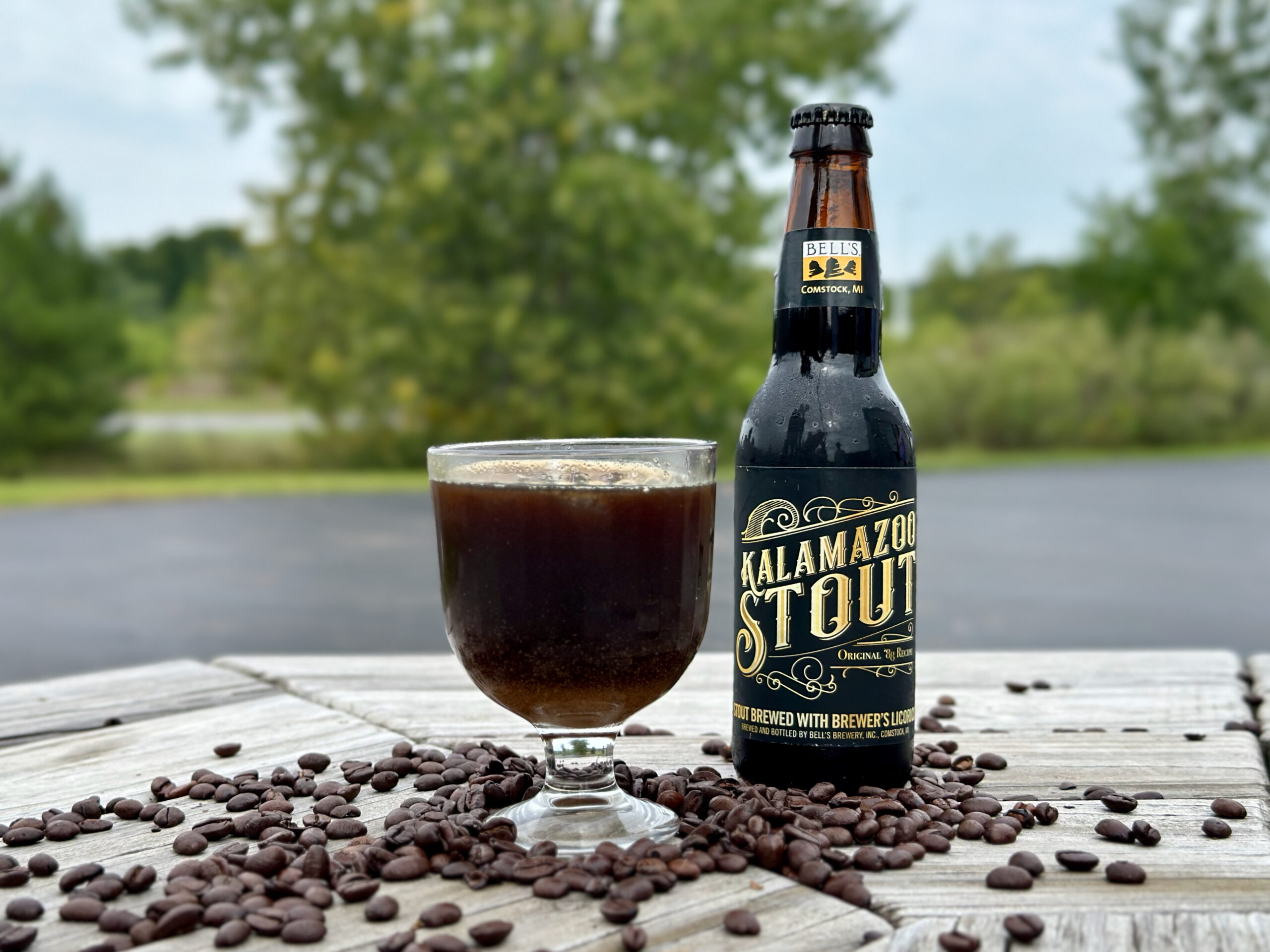 Kalamazoo Stout and Cold Brew Cocktail in a glass with a bottle of Kalamazoo Stout