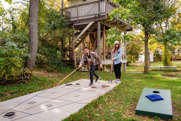 two people playing Shuffleboard